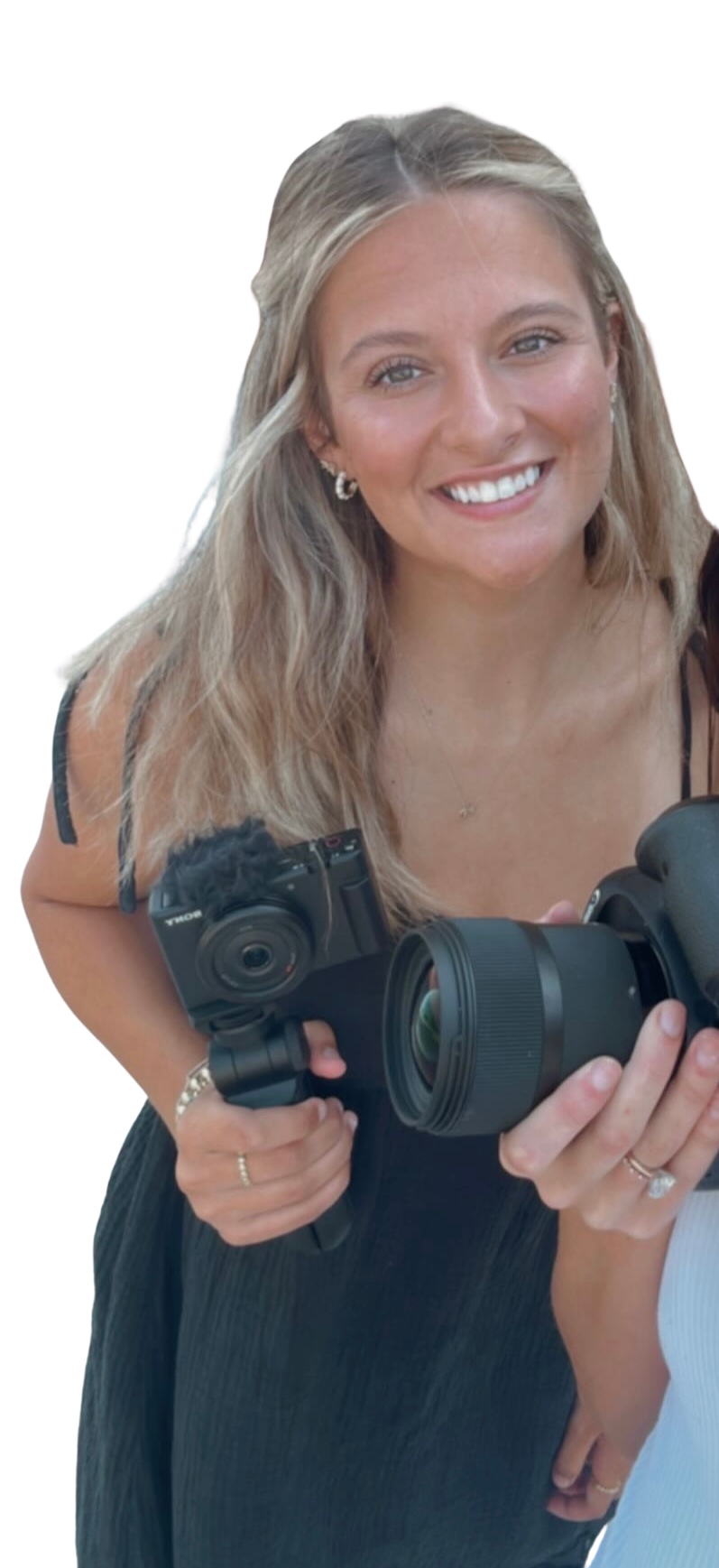 Picture of Chase holding camera that she uses to film YouTube videos.